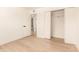 Minimalist bedroom with hardwood floors and closet in the hallway at 3118 W Windrose Dr, Phoenix, AZ 85029