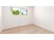 Cozy bedroom featuring hardwood floors and a window with natural light at 3118 W Windrose Dr, Phoenix, AZ 85029