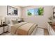 Bedroom featuring neutral tones, a large window, and stylish decor at 3118 W Windrose Dr, Phoenix, AZ 85029