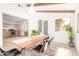 Modern dining room with wood beams, ample natural light, open to the kitchen at 3118 W Windrose Dr, Phoenix, AZ 85029