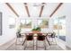 Bright dining room featuring wood table, modern chairs, and plenty of natural light at 3118 W Windrose Dr, Phoenix, AZ 85029