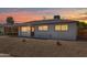 Well-lit single-story home with a carport and gravel landscaping at 3118 W Windrose Dr, Phoenix, AZ 85029