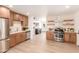 Modern kitchen featuring stainless steel appliances and open layout to the living area at 3118 W Windrose Dr, Phoenix, AZ 85029