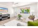 Cozy living room with plush seating, neutral tones, and bright natural light at 3118 W Windrose Dr, Phoenix, AZ 85029