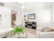 Open-concept living area with modern decor, television, and bright natural light at 3118 W Windrose Dr, Phoenix, AZ 85029