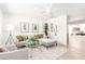 Open living area with stylish decor, neutral furniture, and lots of natural light at 3118 W Windrose Dr, Phoenix, AZ 85029