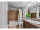 Cozy bathroom featuring tiled shower over tub, vanity and ample lighting perfect for everyday routines at 357 E Thomas Rd # A208, Phoenix, AZ 85012