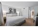Spacious bedroom featuring a large bed, stylish artwork, and ample natural light creating a calming retreat at 357 E Thomas Rd # A208, Phoenix, AZ 85012