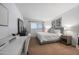 Comfortable bedroom with a serene ambiance enhanced by a well-lit window and neutral decor at 357 E Thomas Rd # A208, Phoenix, AZ 85012