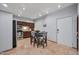 Kitchen and dining area with stainless appliances, wooden cabinets, and tile flooring at 357 E Thomas Rd # A208, Phoenix, AZ 85012