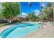 Inviting community pool surrounded by lush greenery and ample lounging space for ultimate relaxation at 357 E Thomas Rd # A208, Phoenix, AZ 85012