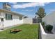 Lush backyard featuring artificial turf, perfect for outdoor games and relaxation under the bright sky at 3814 N 36Th St, Phoenix, AZ 85018