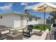 An inviting backyard patio features sleek pavers and comfortable wicker furniture at 3814 N 36Th St, Phoenix, AZ 85018