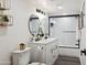 Bright bathroom features dual sinks, updated lighting, and decorative black hardware at 3814 N 36Th St, Phoenix, AZ 85018