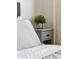 Nightstand with plant on the corner of the comfortable bedroom featuring gray upholstered bed frame at 3814 N 36Th St, Phoenix, AZ 85018