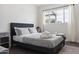Comfortable bedroom featuring gray upholstered bed frame and a modern gray nightstand at 3814 N 36Th St, Phoenix, AZ 85018