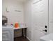 Functional laundry room with modern appliances, ample counter space, and clean white walls and door at 3814 N 36Th St, Phoenix, AZ 85018