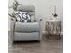 Comfortable recliner with a decorative pillow sits next to a side table with a plant, enhancing this living space at 3814 N 36Th St, Phoenix, AZ 85018