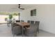 A large outdoor dining table and seating area offers ample space for guests to enjoy meals and good company at 3814 N 36Th St, Phoenix, AZ 85018