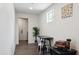 A bonus room featuring wood floors, a small table, natural light and a plant at 3814 N 36Th St, Phoenix, AZ 85018