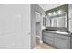 Updated bathroom featuring modern vanity with ample storage and stylish mirror at 3825 E Camelback Rd # 182, Phoenix, AZ 85018