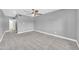 Spacious bedroom with neutral carpet, modern ceiling fan, and plenty of natural light at 3825 E Camelback Rd # 182, Phoenix, AZ 85018