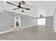 Expansive living area with luxury vinyl flooring and arched entryway leading to a bathroom at 3825 E Camelback Rd # 182, Phoenix, AZ 85018