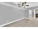 Large, airy living room features luxury vinyl flooring and a modern ceiling fan at 3825 E Camelback Rd # 182, Phoenix, AZ 85018