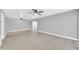 Large open living room with modern ceiling fans and stylish luxury vinyl flooring at 3825 E Camelback Rd # 182, Phoenix, AZ 85018
