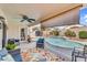 Outdoor patio with comfortable seating, a ceiling fan, and a view of the pool at 38771 N Dena Dr, San Tan Valley, AZ 85140