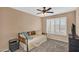 Bedroom with neutral walls, a ceiling fan, a daybed, and a window with white shutters at 38771 N Dena Dr, San Tan Valley, AZ 85140