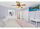 Bright bedroom with a ceiling fan, light purple walls, and white furniture at 38771 N Dena Dr, San Tan Valley, AZ 85140