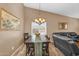 Dining table set in a space with shuttered windows near a comfortable living space at 38771 N Dena Dr, San Tan Valley, AZ 85140