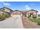 Attractive single-Gathering home with a well-maintained yard and a spacious driveway at 38771 N Dena Dr, San Tan Valley, AZ 85140