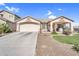 Charming single-Gathering home featuring a well-manicured lawn, desert landscaping and a two-car garage at 38771 N Dena Dr, San Tan Valley, AZ 85140