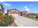 Charming single-story home with a well-manicured lawn, desert landscaping, and a spacious driveway at 38771 N Dena Dr, San Tan Valley, AZ 85140