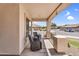 Inviting covered porch with cozy seating and a street view at 38771 N Dena Dr, San Tan Valley, AZ 85140