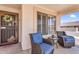 Welcoming front porch featuring comfortable seating and charming decor at 38771 N Dena Dr, San Tan Valley, AZ 85140
