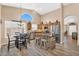 Eat-in kitchen featuring an island with bar seating, stainless steel appliances, and a dining table at 38771 N Dena Dr, San Tan Valley, AZ 85140