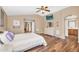 Comfortable main bedroom with a TV, closet, and access to a connected bathroom at 38771 N Dena Dr, San Tan Valley, AZ 85140