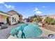 Sparkling swimming pool with a tranquil waterfall feature in a private backyard at 38771 N Dena Dr, San Tan Valley, AZ 85140