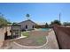 Large backyard with perimeter brick wall, pool and exterior storage at 3897 E Douglas Loop, Gilbert, AZ 85234