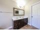 Bathroom with double sink vanity and large framed mirror at 3897 E Douglas Loop, Gilbert, AZ 85234