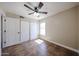 A clean bedroom offers natural light, tiled floors, and a ceiling fan for added comfort at 3897 E Douglas Loop, Gilbert, AZ 85234