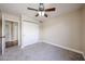 Bedroom featuring neutral carpet, closet with double doors, and ceiling fan for added comfort at 3897 E Douglas Loop, Gilbert, AZ 85234