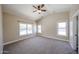 Spacious bedroom with neutral carpet, high ceilings, and an abundance of natural light at 3897 E Douglas Loop, Gilbert, AZ 85234