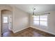 Dining area with tile flooring, a modern light fixture, and a view of the yard at 3897 E Douglas Loop, Gilbert, AZ 85234