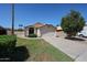 Charming home with a two-car garage, mature trees, and a well-kept lawn at 3897 E Douglas Loop, Gilbert, AZ 85234