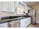 Close-up of the kitchen featuring stainless steel appliances and 'Bon Appetit' decor at 3897 E Douglas Loop, Gilbert, AZ 85234