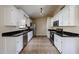 Well-lit kitchen with white cabinets, stainless steel appliances, and tile flooring at 3897 E Douglas Loop, Gilbert, AZ 85234
